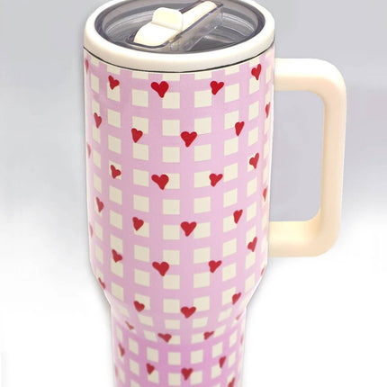 A tall 40oz stainless steel travel tumbler with a built-in handle, flip straw lid, and tapered base designed to fit in car cupholders.