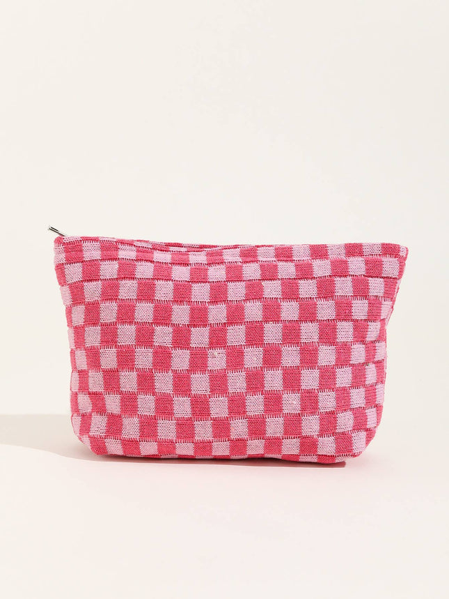 Pink and white checkered pouch on a light beige background