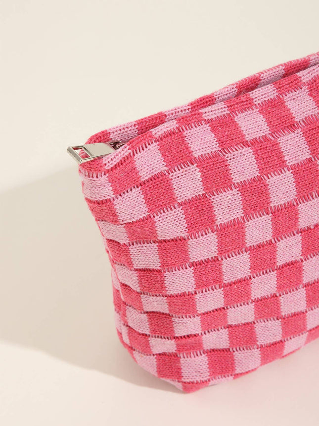 Pink and white checkered pouch on a beige background