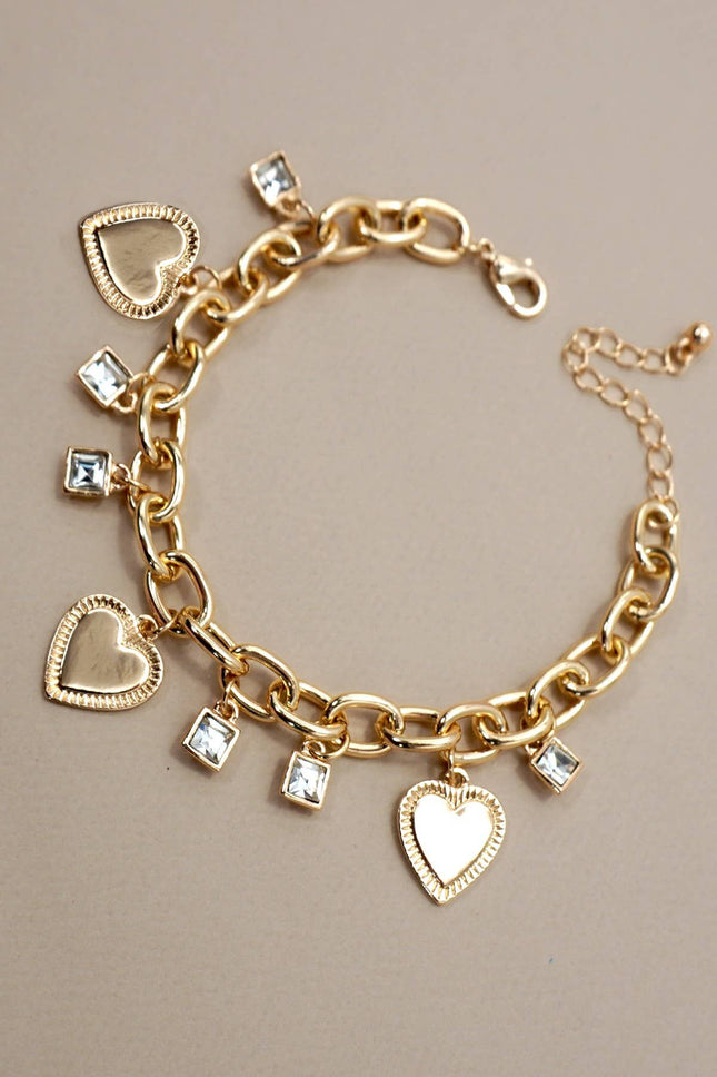 Gold chain bracelet with textured heart charms and square rhinestone cubes, 7.5” length with adjustable extender