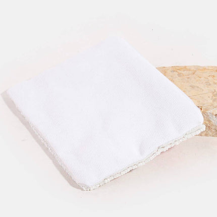 Back of coin purse on a wooden surface