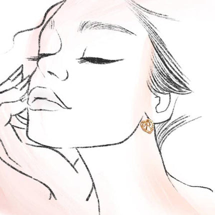 Gold-plated heart-shaped bow stud earrings with post back and anti-tarnish finish, 0.7 inches wide.