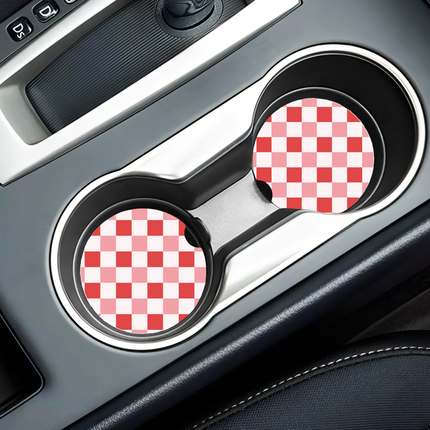 Two Valentine’s Day–themed neoprene car coasters with heart and love patterns, shown inside gift-ready packaging and styled on a neutral background.