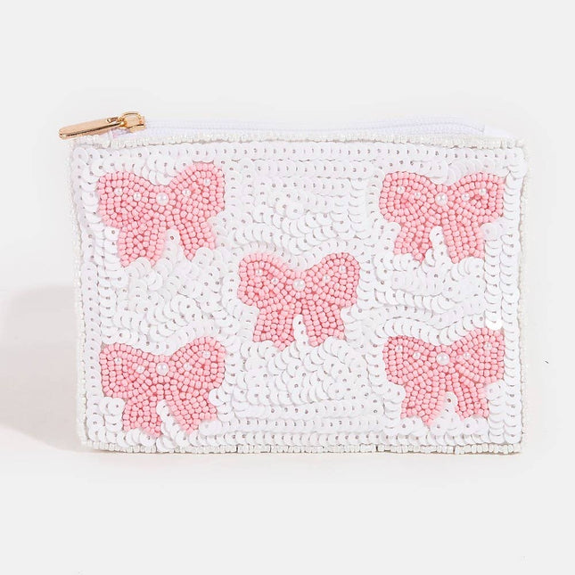 White pouch with pink beaded bows on a white background