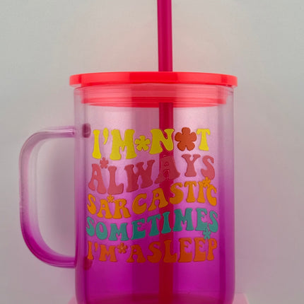 Pink tumbler with a straw and text on a white background