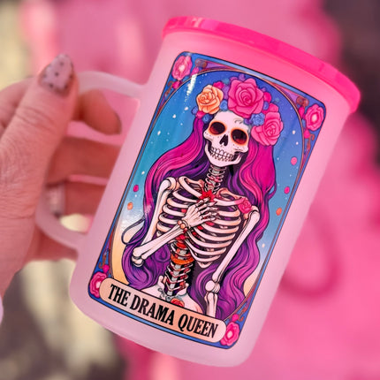 Pink tumbler with a skeleton design labeled 'The Drama Queen' against a pink background