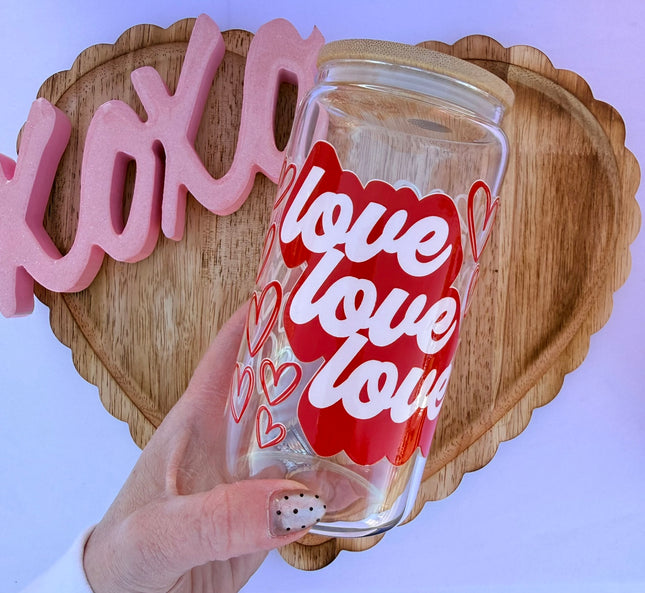Clear 16oz Libbey glass cup with Valentine-themed UV DTF designs, bamboo lid, and glass straw