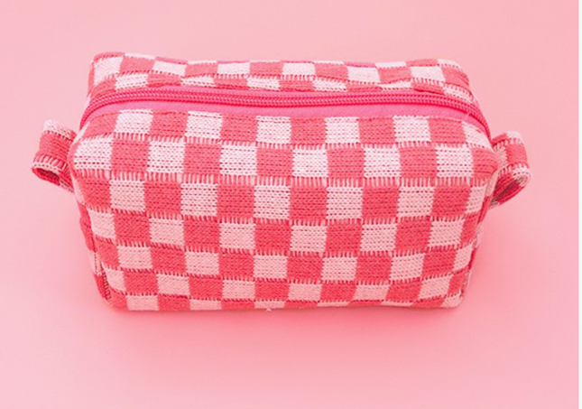 Pink and white checkered pouch on a pink background