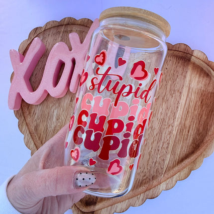 Clear 16oz Libbey glass cup with Valentine-themed UV DTF designs, bamboo lid, and glass straw