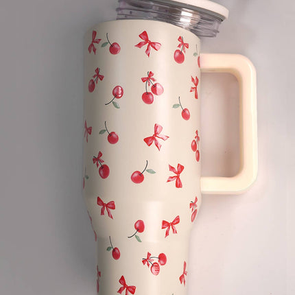 A tall 40oz stainless steel travel tumbler with a built-in handle, flip straw lid, and tapered base designed to fit in car cupholders.