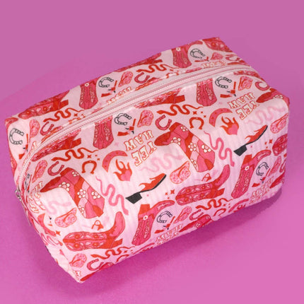 Rectangular pouch with a red and white pattern on a pink background