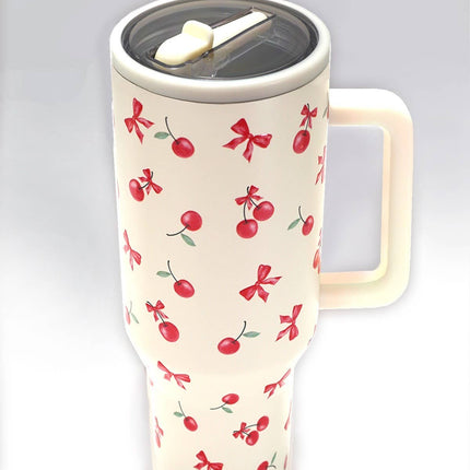 A tall 40oz stainless steel travel tumbler with a built-in handle, flip straw lid, and tapered base designed to fit in car cupholders.