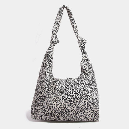 Leopard print shoulder bag on a white background