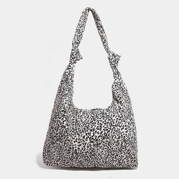Leopard print shoulder bag on a white background