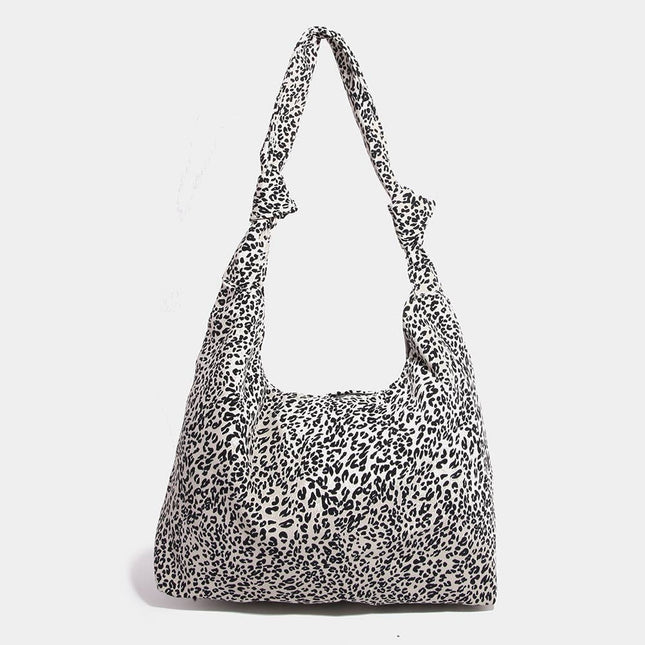 Leopard print shoulder bag on a white background