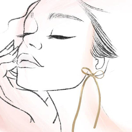 Earring with a bow detail on a white background